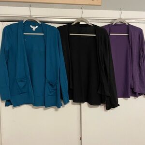 Three women’s cardigans